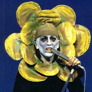 peter gabriel red dress fox head Here Peter Gabriel wore the red dress and a fox's head on stage for the  following tour, which gathered press attention and greatly improved the  group's profile. #genesis #genesisfan #progressive #progressiverock #rock #